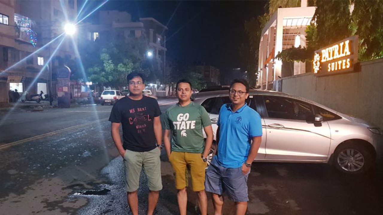 Three young men in Rajkot at night